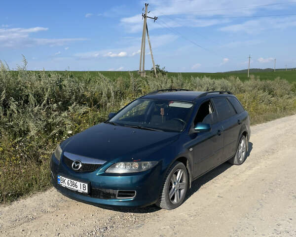 Синий Мазда 6, объемом двигателя 2 л и пробегом 310 тыс. км за 4200 $, фото 4 на Automoto.ua