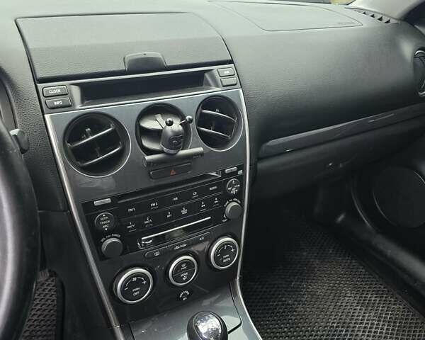 Синий Мазда 6, объемом двигателя 2 л и пробегом 250 тыс. км за 4250 $, фото 5 на Automoto.ua