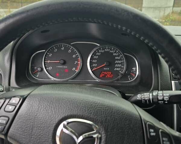 Синий Мазда 6, объемом двигателя 2 л и пробегом 250 тыс. км за 4250 $, фото 1 на Automoto.ua