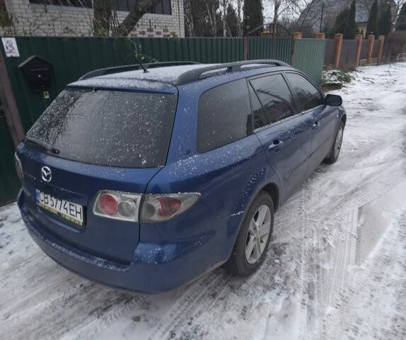 Синій Мазда 6, об'ємом двигуна 2 л та пробігом 243 тис. км за 5600 $, фото 2 на Automoto.ua