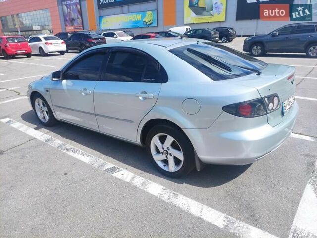 Синий Мазда 6, объемом двигателя 2 л и пробегом 300 тыс. км за 5500 $, фото 1 на Automoto.ua