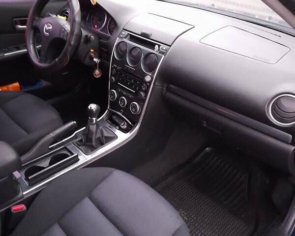 Синий Мазда 6, объемом двигателя 1.8 л и пробегом 205 тыс. км за 4800 $, фото 1 на Automoto.ua
