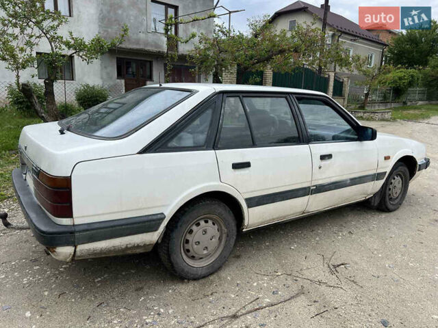 Белый Мазда 626, объемом двигателя 1.58 л и пробегом 250 тыс. км за 650 $, фото 2 на Automoto.ua
