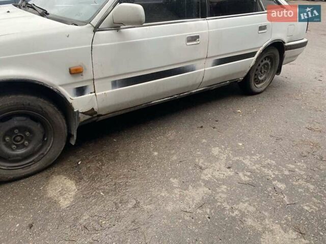 Белый Мазда 626, объемом двигателя 2 л и пробегом 400 тыс. км за 600 $, фото 7 на Automoto.ua