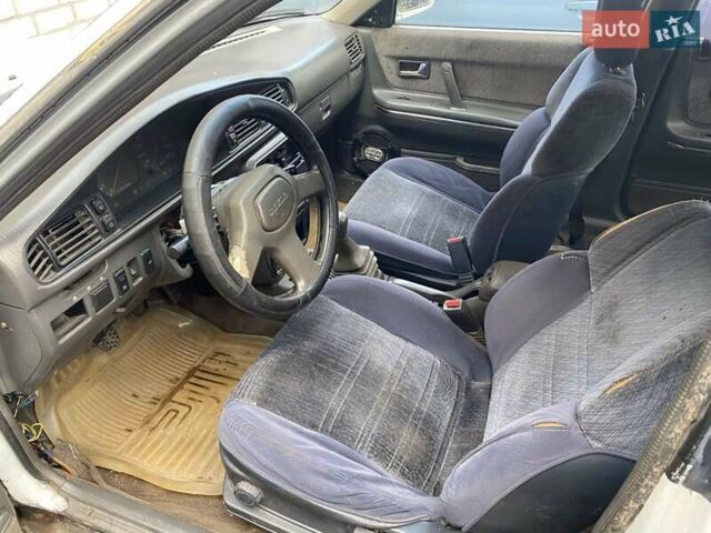 Белый Мазда 626, объемом двигателя 2 л и пробегом 400 тыс. км за 600 $, фото 4 на Automoto.ua