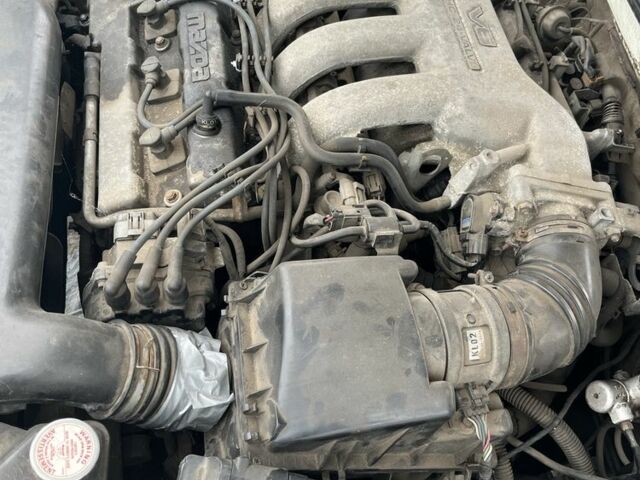 Белый Мазда 626, объемом двигателя 2.5 л и пробегом 327 тыс. км за 600 $, фото 2 на Automoto.ua