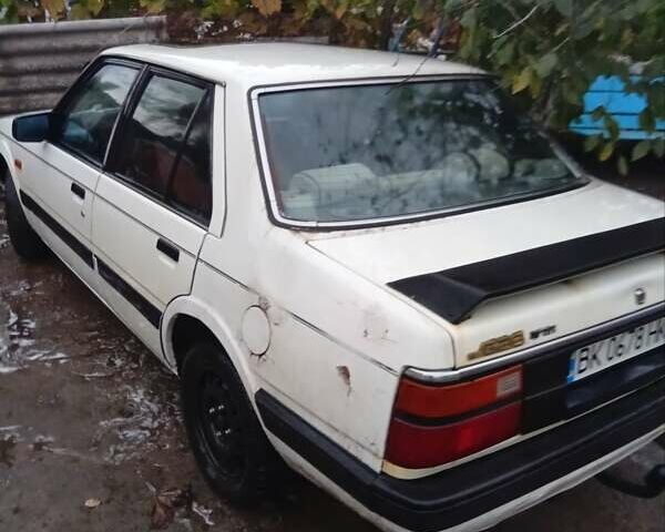 Белый Мазда 626, объемом двигателя 2 л и пробегом 344 тыс. км за 800 $, фото 2 на Automoto.ua