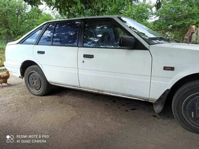 Белый Мазда 626, объемом двигателя 2 л и пробегом 380 тыс. км за 600 $, фото 3 на Automoto.ua