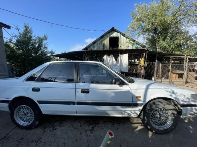 Белый Мазда 626, объемом двигателя 2 л и пробегом 429 тыс. км за 953 $, фото 3 на Automoto.ua