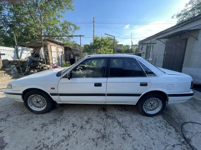 Белый Мазда 626, объемом двигателя 2 л и пробегом 429 тыс. км за 953 $, фото 2 на Automoto.ua