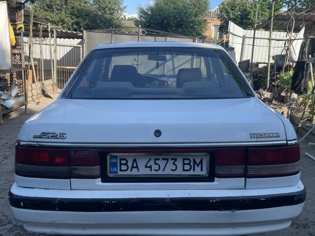 Белый Мазда 626, объемом двигателя 2 л и пробегом 429 тыс. км за 953 $, фото 1 на Automoto.ua