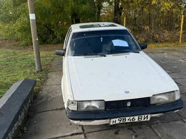 Белый Мазда 626, объемом двигателя 2 л и пробегом 200 тыс. км за 345 $, фото 2 на Automoto.ua