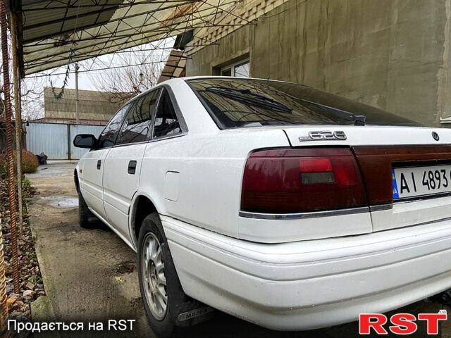 Белый Мазда 626, объемом двигателя 2 л и пробегом 356 тыс. км за 2200 $, фото 1 на Automoto.ua