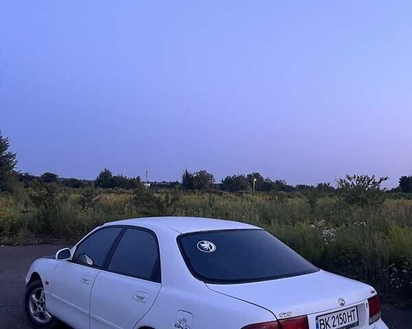 Белый Мазда 626, объемом двигателя 1.84 л и пробегом 400 тыс. км за 1446 $, фото 12 на Automoto.ua