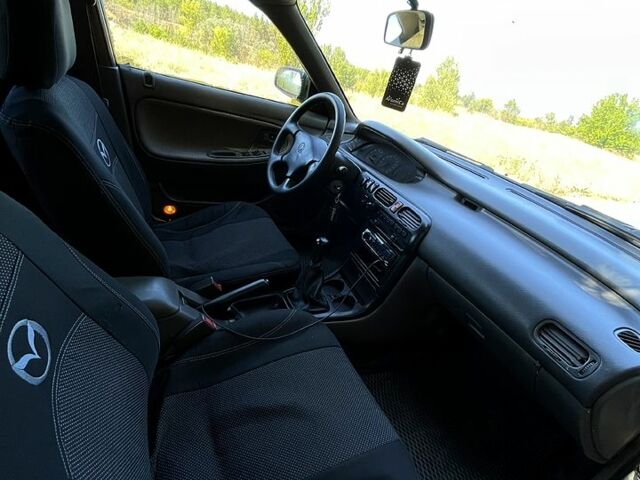 Білий Мазда 626, об'ємом двигуна 1.8 л та пробігом 303 тис. км за 1500 $, фото 9 на Automoto.ua