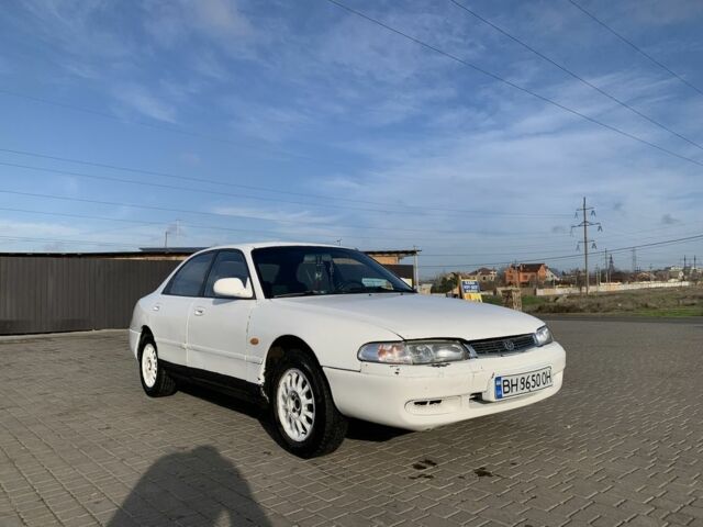 Белый Мазда 626, объемом двигателя 2 л и пробегом 150 тыс. км за 1200 $, фото 1 на Automoto.ua