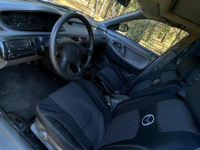 Білий Мазда 626, об'ємом двигуна 1.8 л та пробігом 303 тис. км за 1500 $, фото 7 на Automoto.ua