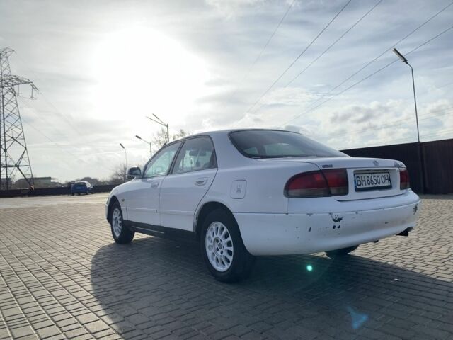 Белый Мазда 626, объемом двигателя 2 л и пробегом 150 тыс. км за 1200 $, фото 2 на Automoto.ua