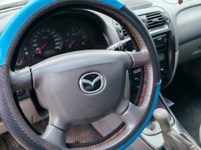 Белый Мазда 626, объемом двигателя 2 л и пробегом 300 тыс. км за 1800 $, фото 5 на Automoto.ua