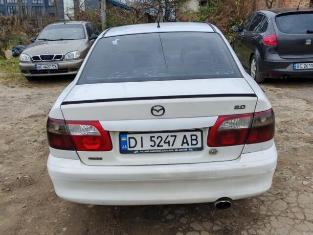 Белый Мазда 626, объемом двигателя 2 л и пробегом 300 тыс. км за 1800 $, фото 3 на Automoto.ua