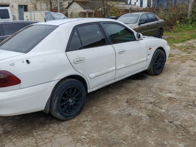 Белый Мазда 626, объемом двигателя 2 л и пробегом 300 тыс. км за 1800 $, фото 4 на Automoto.ua