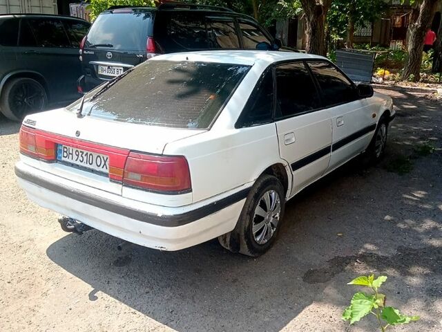 Білий Мазда 626, об'ємом двигуна 2 л та пробігом 111 тис. км за 1350 $, фото 1 на Automoto.ua