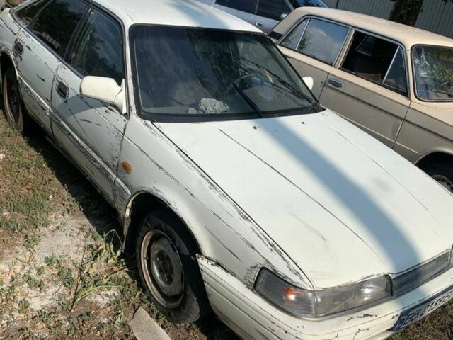 Белый Мазда 626, объемом двигателя 2 л и пробегом 300 тыс. км за 523 $, фото 2 на Automoto.ua