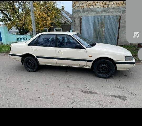 Бежевый Мазда 626, объемом двигателя 2 л и пробегом 210 тыс. км за 1800 $, фото 5 на Automoto.ua