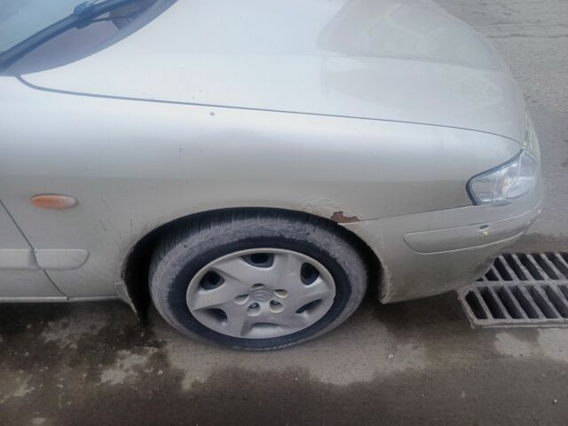 Бежевый Мазда 626, объемом двигателя 2 л и пробегом 300 тыс. км за 2800 $, фото 7 на Automoto.ua