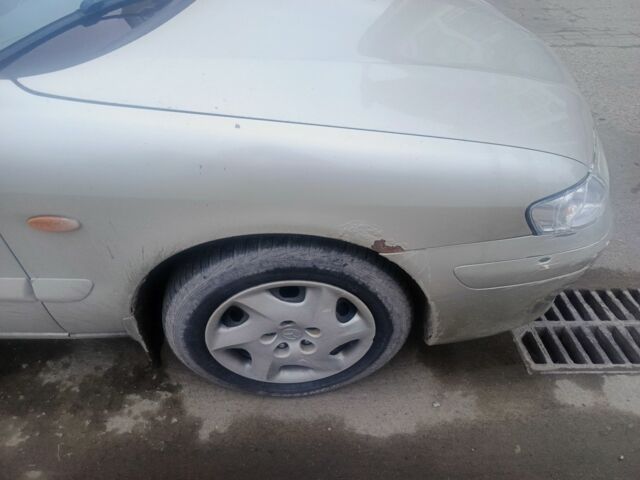 Бежевый Мазда 626, объемом двигателя 2 л и пробегом 300 тыс. км за 2800 $, фото 8 на Automoto.ua