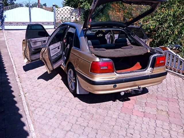 Бежевый Мазда 626, объемом двигателя 2 л и пробегом 500 тыс. км за 1150 $, фото 3 на Automoto.ua