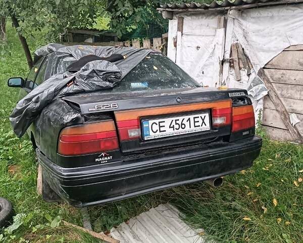 Черный Мазда 626, объемом двигателя 2.2 л и пробегом 400 тыс. км за 500 $, фото 3 на Automoto.ua