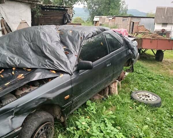 Черный Мазда 626, объемом двигателя 2.2 л и пробегом 400 тыс. км за 500 $, фото 1 на Automoto.ua