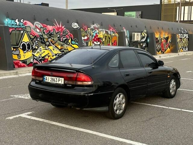 Черный Мазда 626, объемом двигателя 2.5 л и пробегом 483 тыс. км за 1200 $, фото 2 на Automoto.ua