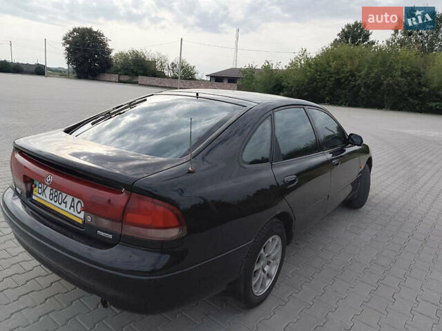 Черный Мазда 626, объемом двигателя 1.84 л и пробегом 430 тыс. км за 1900 $, фото 1 на Automoto.ua