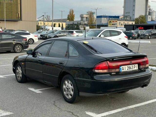 Черный Мазда 626, объемом двигателя 2.5 л и пробегом 483 тыс. км за 1200 $, фото 3 на Automoto.ua