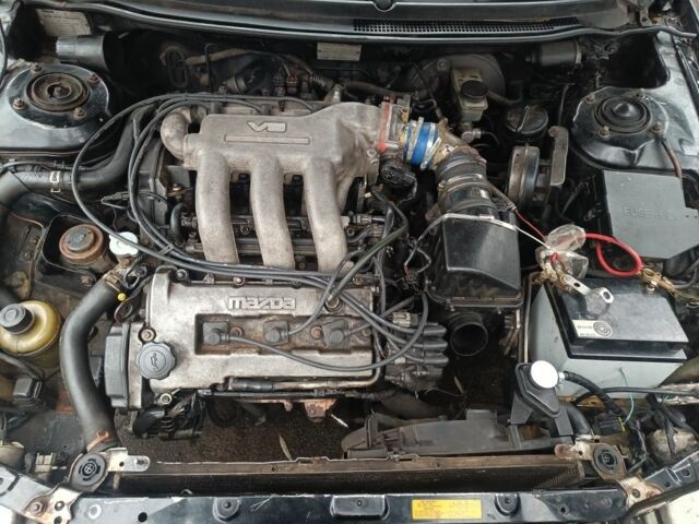 Черный Мазда 626, объемом двигателя 2.5 л и пробегом 480 тыс. км за 1400 $, фото 3 на Automoto.ua