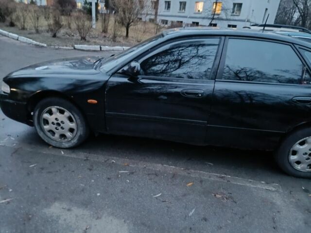 Черный Мазда 626, объемом двигателя 2.5 л и пробегом 480 тыс. км за 1400 $, фото 1 на Automoto.ua