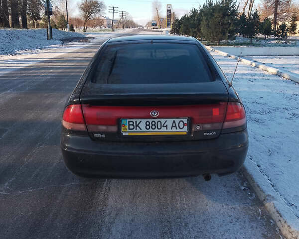 Черный Мазда 626, объемом двигателя 1.84 л и пробегом 430 тыс. км за 1900 $, фото 4 на Automoto.ua