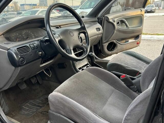 Черный Мазда 626, объемом двигателя 2.5 л и пробегом 483 тыс. км за 1200 $, фото 9 на Automoto.ua