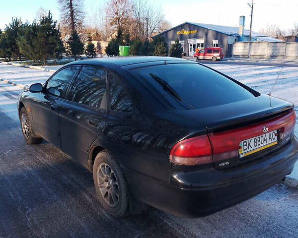 Черный Мазда 626, объемом двигателя 1.84 л и пробегом 430 тыс. км за 1900 $, фото 6 на Automoto.ua