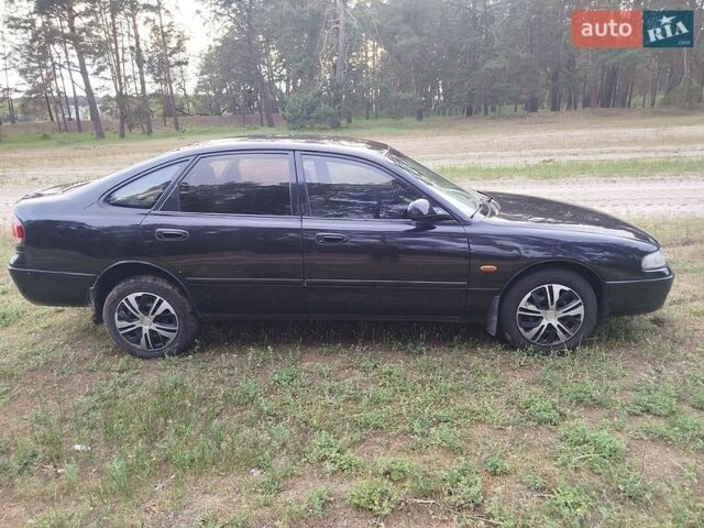 Чорний Мазда 626, об'ємом двигуна 1.8 л та пробігом 452 тис. км за 1800 $, фото 12 на Automoto.ua