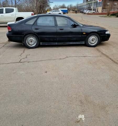 Черный Мазда 626, объемом двигателя 2.5 л и пробегом 380 тыс. км за 1500 $, фото 7 на Automoto.ua