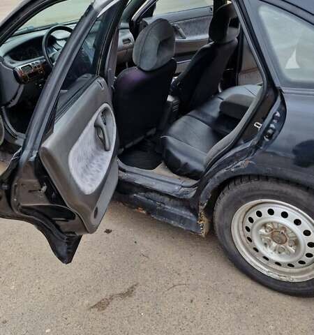 Черный Мазда 626, объемом двигателя 2.5 л и пробегом 380 тыс. км за 1500 $, фото 2 на Automoto.ua