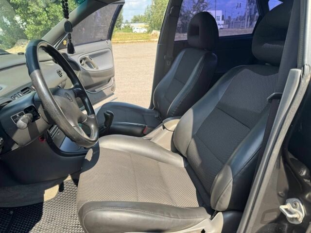 Черный Мазда 626, объемом двигателя 1.8 л и пробегом 310 тыс. км за 3000 $, фото 2 на Automoto.ua