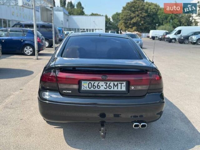 Черный Мазда 626, объемом двигателя 1.8 л и пробегом 310 тыс. км за 3000 $, фото 14 на Automoto.ua