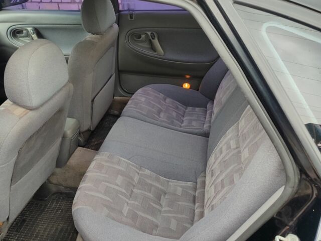 Черный Мазда 626, объемом двигателя 2 л и пробегом 573 тыс. км за 1100 $, фото 5 на Automoto.ua