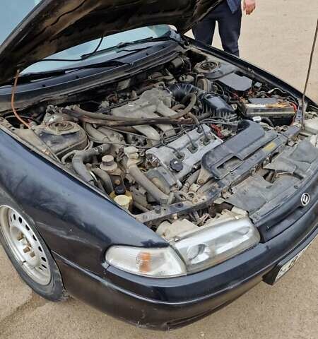 Черный Мазда 626, объемом двигателя 2.5 л и пробегом 380 тыс. км за 1500 $, фото 3 на Automoto.ua