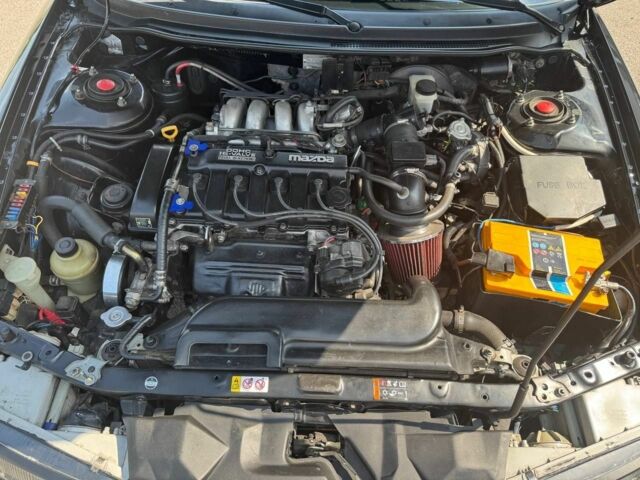 Черный Мазда 626, объемом двигателя 1.8 л и пробегом 310 тыс. км за 3000 $, фото 5 на Automoto.ua