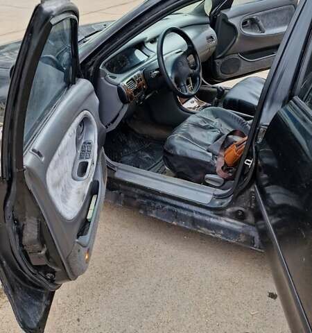 Черный Мазда 626, объемом двигателя 2.5 л и пробегом 380 тыс. км за 1500 $, фото 4 на Automoto.ua